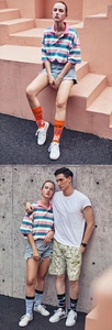Detail of colorful striped crew socks styled with retro denim shorts for street fashion