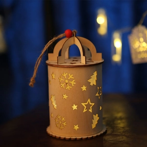 Illuminated Christmas wooden lantern with hollow star patterns and warm LED light hanging decor