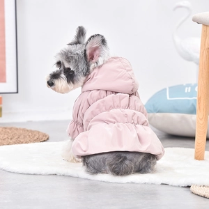 Detail of pink floral puffer dress for dogs featuring warm quilted fabric and ruffled hem