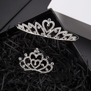 Detailed view of silver princess tiara and hair comb with sparkling rhinestones for girls