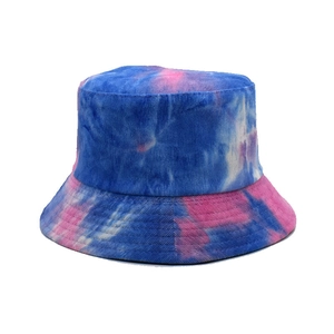 Close-up showing vibrant blue and pink tie-dye texture on corduroy bucket hat fabric