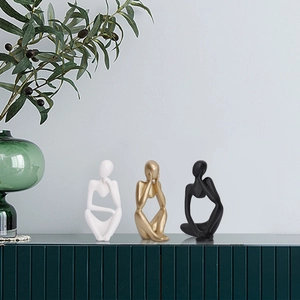 Minimalist resin thinker sculpture set in black white and gold for modern home decor