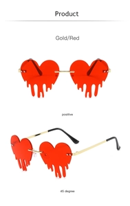 Macro detail of rimless heart-shaped sunglasses with melting drip lenses and gold frame
