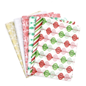 Christmas tissue paper sheets with festive patterns for gift wrapping and holiday crafts