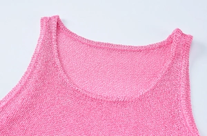 Detailed view of the crew neck and fine knit texture on this pink summer sleeveless dress