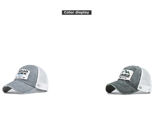 Detail view of cotton ponytail baseball caps featuring embroidery and white mesh panels