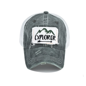 Distressed cotton trucker hat with white mesh and Explorer mountain patch detail