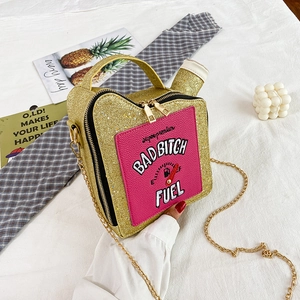 Detail of creative oil barrel shaped bag featuring sequin embroidery and chain strap