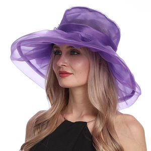 Detail view of purple organza sun hat with layered mesh texture on a female model