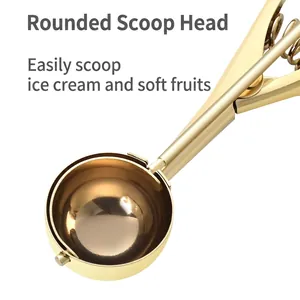 Golden 304 stainless steel ice cream scoop with spring release handle on white background
