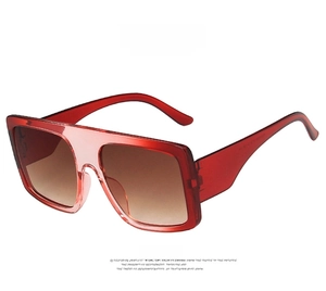 Front view of oversized square shield sunglasses with transparent red gradient frame