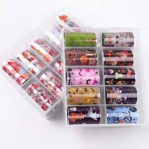 10 rolls of Halloween nail foil transfer stickers with pumpkins and ghosts in a clear storage box