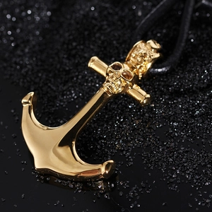 Golden anchor and skull pendant on black braided cord with a high-polish mirror finish