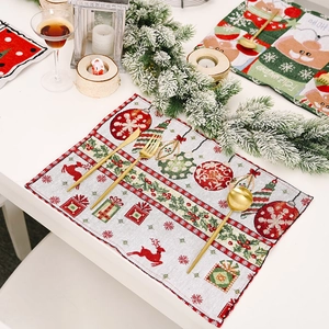 Christmas knit placemat featuring reindeer and snowflake patterns for holiday dining table decor