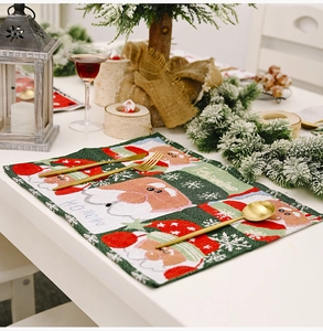 Detailed knitted Christmas placemat featuring Santa Claus and Feliz Navidad text