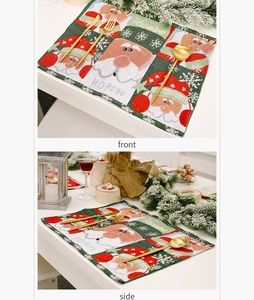 Detail of knitted Christmas placemats featuring Santa Claus patterns and snowflake motifs