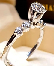 Macro detail of men's vintage ring featuring a green zircon with a six-prong setting