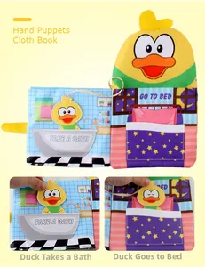 Detail of interactive duck hand puppet cloth book with bath and sleep learning scenes