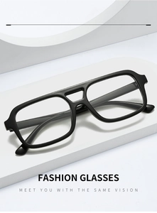 Close-up of stylish black double-bridge frame glasses with clear lenses on white podium