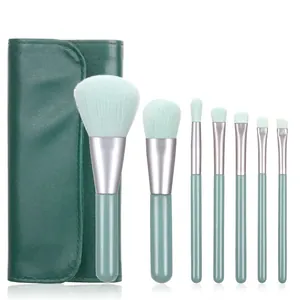 7pcs mini makeup brush set with green bristles and matching leather storage pouch
