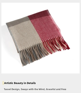 Close-up of red and beige checkered scarf with soft cashmere-like texture and tassel fringe