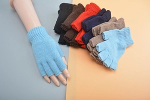 Detail showing various colors of knitted wool half-finger gloves on split background