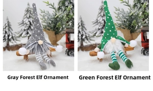 Close-up of grey and green Christmas gnome ornaments with LED lights and knitted hats