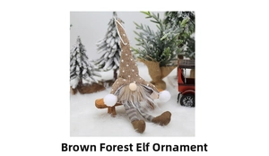 Close-up of a brown Christmas gnome plush with LED light on a miniature wooden bench
