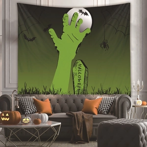 Detail of Halloween tapestry with zombie hand, moon, and tombstone over a sofa