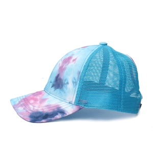 Side view of multi-color tie-dye baseball cap with breathable blue mesh and curved brim