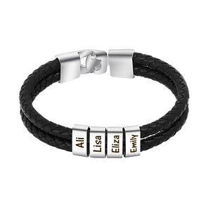 Detail of black braided leather bracelet with four custom engraved silver name beads