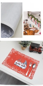 Detailed view of Christmas gnome placemats with festive red patterns and snowy design