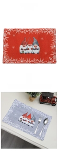 Close-up of Christmas gnomes placemats featuring fabric texture and festive snowflake patterns