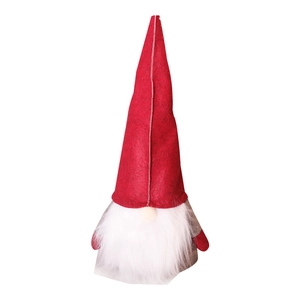 Handmade felt Christmas gnome tree topper with red hat and long white beard on white background
