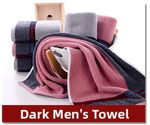Close-up of thick cotton towels with Good Luck embroidery and heart jacquard pattern