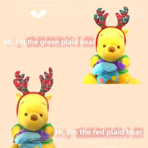 Detail of plush bear headband with red and green plaid reindeer antlers for Christmas