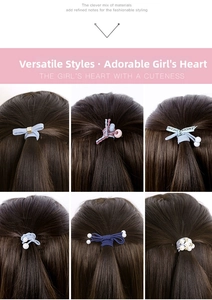 Close-up of assorted elastic hair ties with pearls and bows for ponytail styling