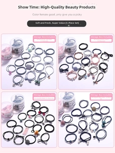 Detail view of 15-piece hair tie set featuring pearls and plaid patterns in a clear jar
