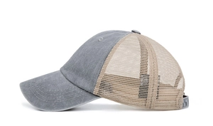 Side view of two-tone mesh trucker hat with washed grey cotton brim and beige net