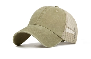 Detail view of olive green washed cotton front and breathable mesh back on baseball cap