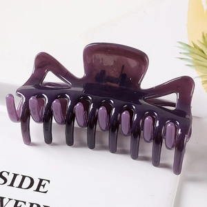 Large translucent purple geometric hair claw clip for women on a white background
