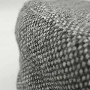 Fashionable grey wool plaid octagonal beret with detailed woven tweed fabric texture
