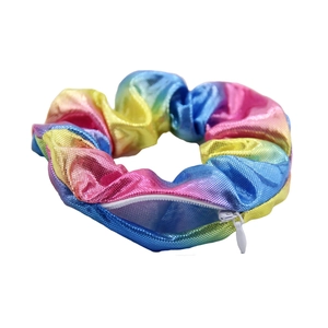 Close-up of rainbow laser scrunchie featuring a hidden zipper pocket and metallic texture