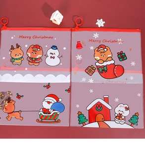 Close-up of a festive transparent Christmas file bag with reindeer and Santa graphics