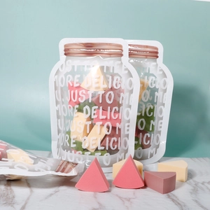 Detail of colorful triangular makeup sponges with transparent storage packaging bags