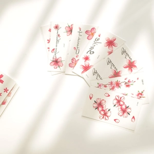 Aesthetic cherry blossom temporary tattoos in various floral designs on white background