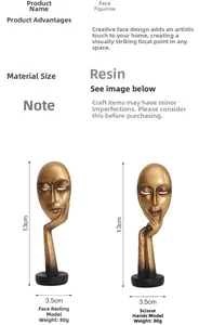 Detail view of two gold resin face masks showing dimensions 13cm height and 3.5cm base