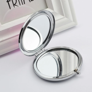 Silver folding metal makeup mirror with dual-sided design and sleek round butterfly style