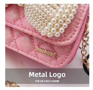 Detail showing pink sequin crossbody bag with quilted stitching and pearl embellishments