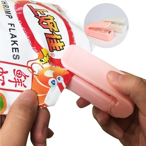 Portable mini bag sealer in pink and white for heat sealing food plastic packaging bags